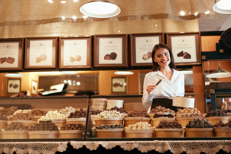 Woman standing in a chocolate shop business